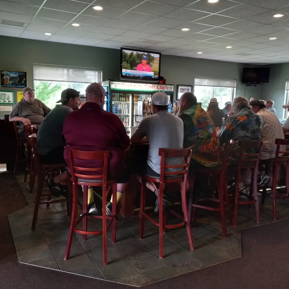 Golfers seated along the bar in the Parkway clubhouse after a round