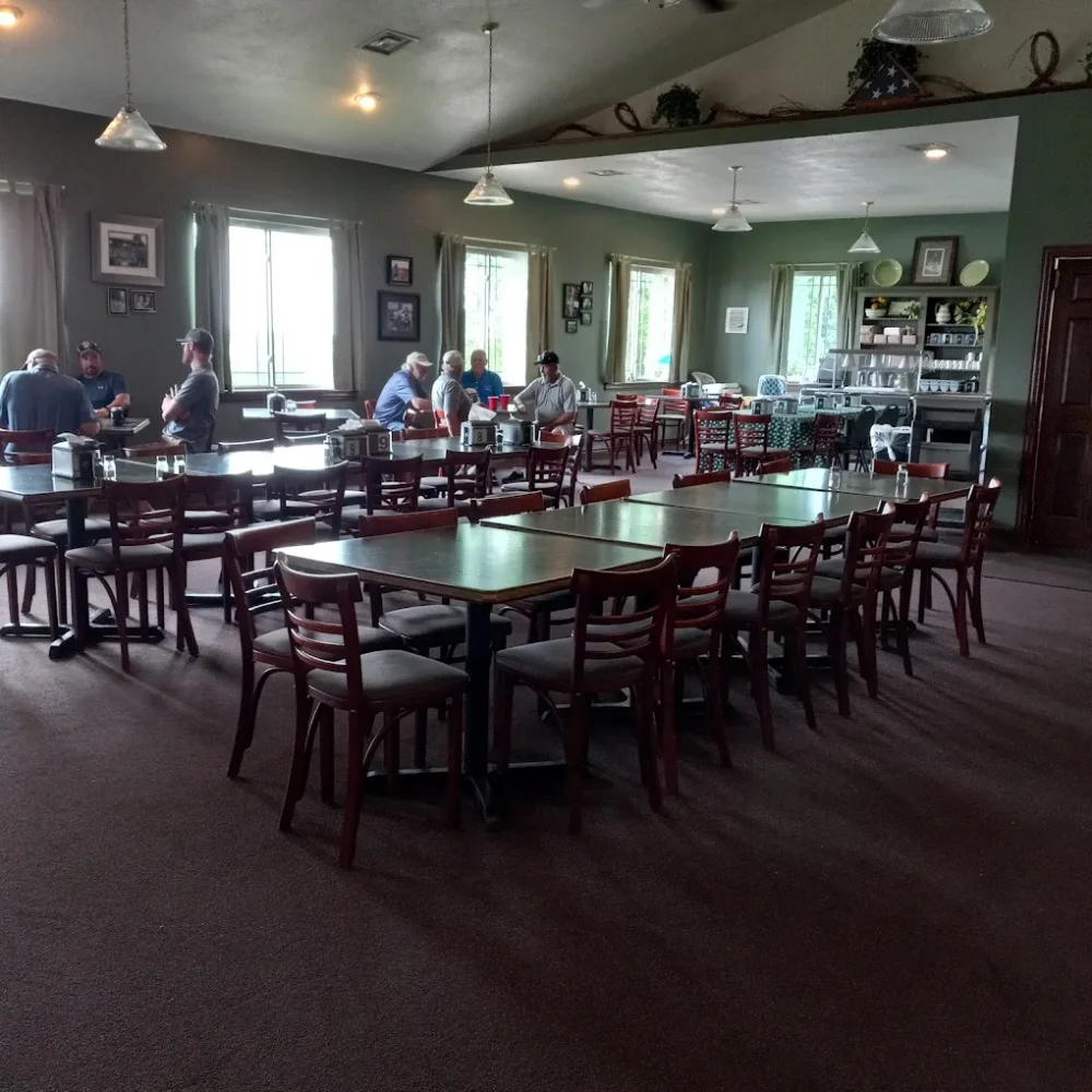 The Parkway clubhouse dining room, with tables set for a group and windows along one wall