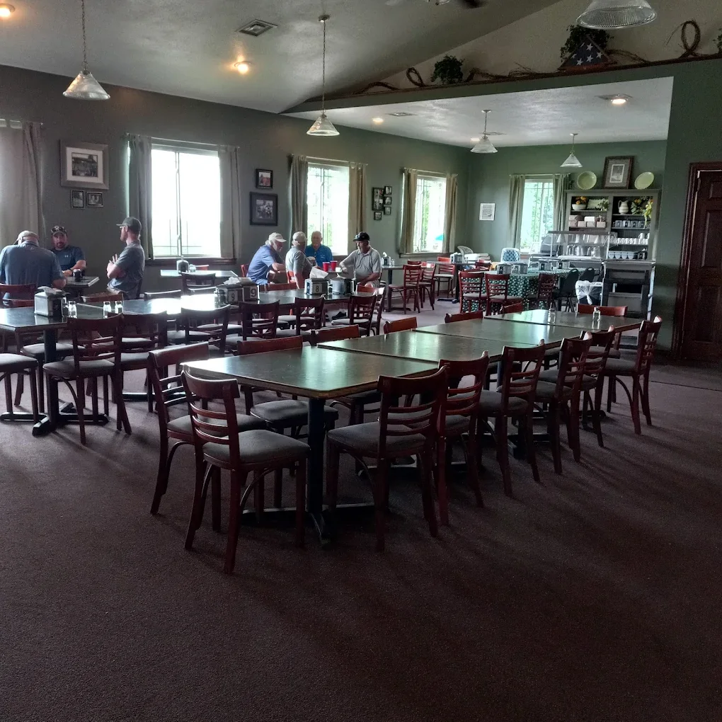 The Parkway clubhouse dining room, with tables set for a group and windows along one wall